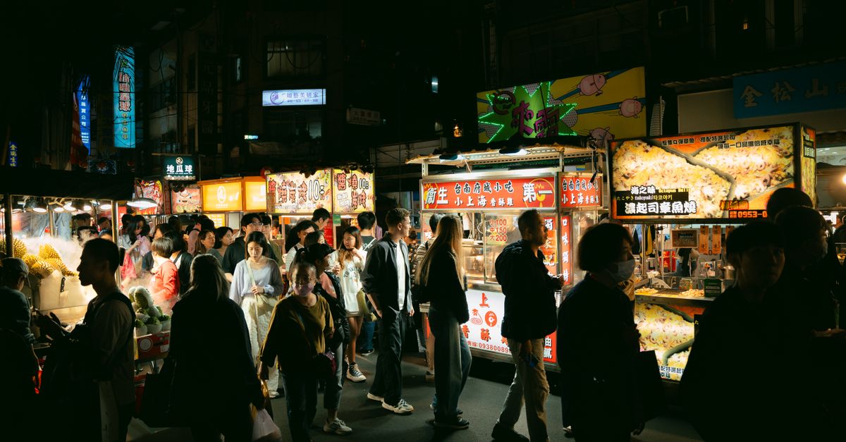 Street food stall beneath the BTS line near Phaya Thai station in Bangkok