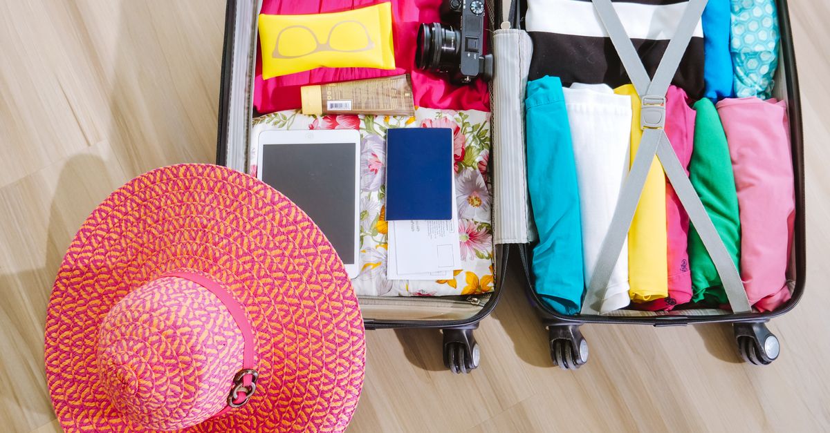 Five-day island hopping packing list laid out around a small daypack