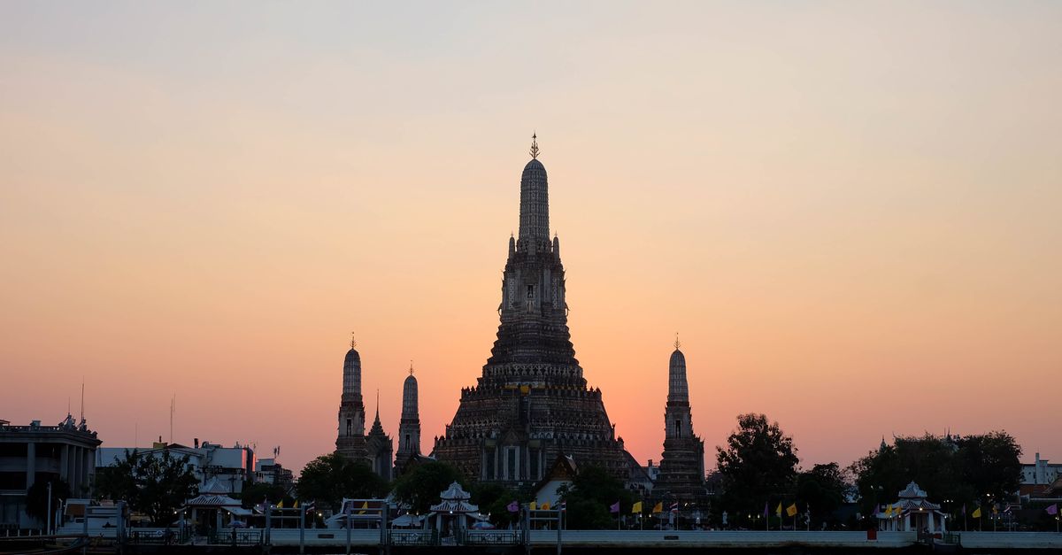 Wat Arun viewed from a Chao Phraya river boat during the morning temple loop of a Bangkok stopover